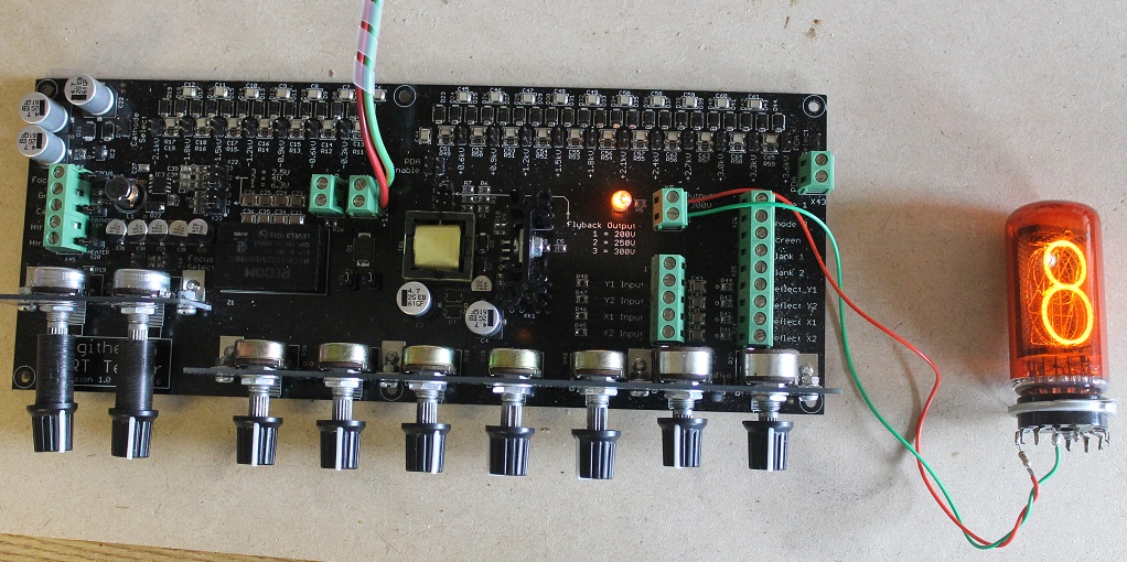 Figure 3 — A ZM1040 Nixie lit on the tester — one of ten stacked digit-shaped cathodes glows inside the common anode gauze. Strike it above ~170 V, hold it on the maintaining voltage, and pick the digit by gr…